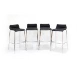 A set of four 'Bjorn' stools in black vinyl with chromed tubular frames by Task