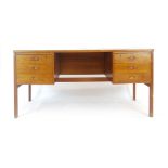 A 1970's Danish teak and crossbanded desk,