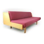 Hans Wegner for Getama, a beech and upholstered daybed, the rear with a storage compartment,