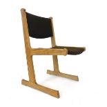 A 1970's Danish oak and upholstered slide chair by Cado CONDITION REPORT: Joints