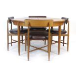 A G-Plan teak and crossbanded circular extending dining table, d.