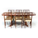 A 1960's Brazilian rosewood dining suite by Sir Gordon Russell including an extending 'Marlow'