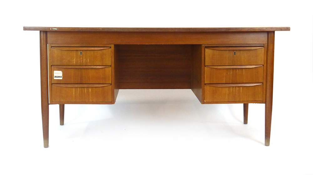 A 1970's Danish teak and crossbanded desk,