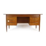 A 1970's Danish teak and crossbanded desk,