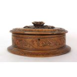 A late 19th century olive wood jewellery casket of oval form surmounted by a floral handle, w.