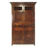 A 19th century painted pine food cupboard having two cupboard doors with spindles over two drawers