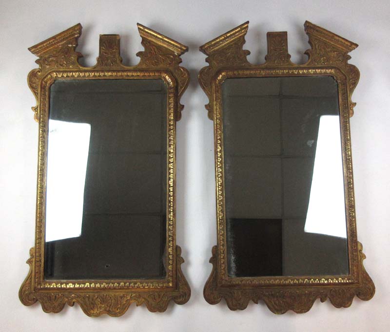 A pair of early 20th century, 18th century style gilt wood mirrors, h. 108 cm, w.