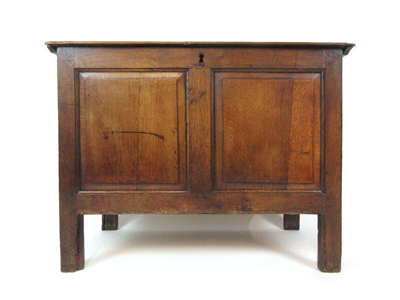 An 18th century and later oak coffer,