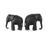 A pair of Anglo-Indian ebony elephants with bone feet, h. 19 cm CONDITION REPORT: 17.