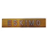 A ship's 'Eskimo' sign, the chromed letters on red painted mounts and a teak back panel, l.