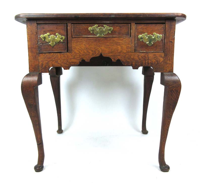 An 18th century style oak lowboy,