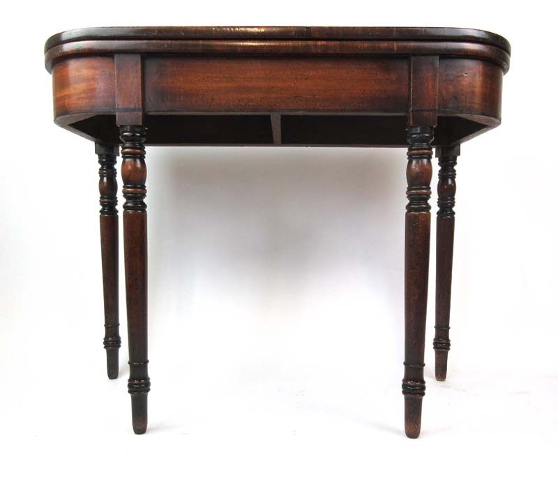 An early 19th century mahogany tea table,