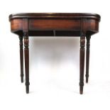 An early 19th century mahogany tea table,