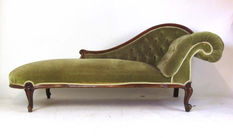 A Victorian mahogany chaise longue upholstered in an olive green cut fabric on cabriole legs, h.