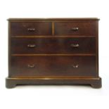 A Victorian mahogany low level chest of two short over two long drawers with carved handles on a