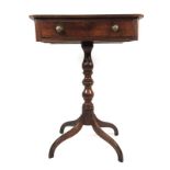 An early 19th century mahogany occasional table having single drawer over turned column on four