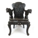 A 19th century Anglo-Chinese open arm chair, the back with carving depicting a dragon in the clouds,