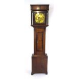 An early 19th century oak and mahogany crossbanded longcase clock,