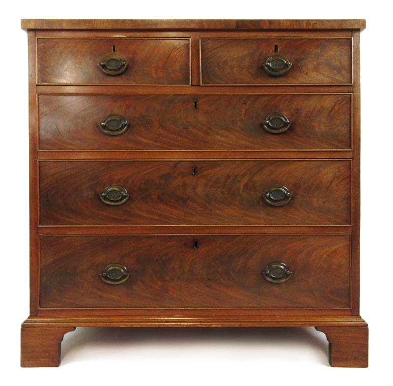 A late 18th century mahogany and crossbanded chest of two short over three long drawers on later