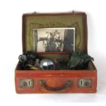 A leather case containing a Second World War RAF pilot's headset,