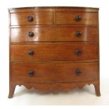 A 19th century mahogany and rosewood crossbanded bow front chest of two short over three long