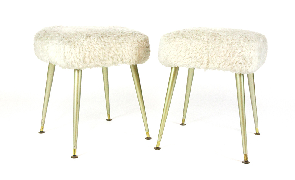 A pair of 1960's woolen stools with gold plastic tapering legs