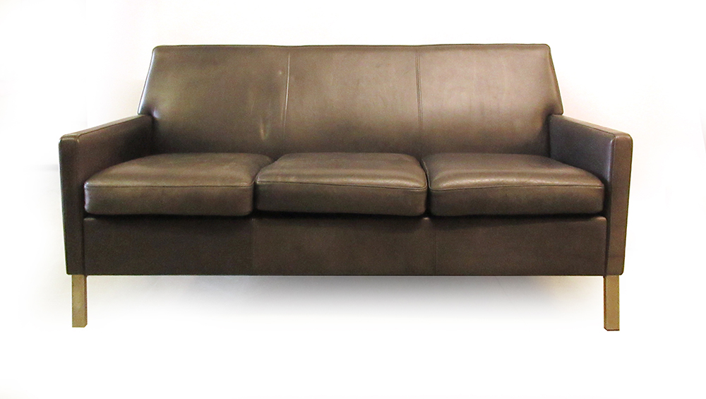 A black three seater reception-type sofa on aluminium feet