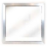 A brushed metal overmantle mirror with a pie-crust frame, retailed by Conran,