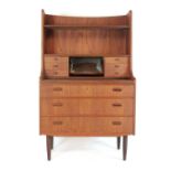 A 1960's teak bureau bookcase with an arrangement of shelves, mirrored compartment,