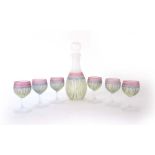 A Scandinavian glass decanter and stopper with six matching goblets, each decorated with a blue,