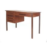 A 1970's teak and crossbanded desk with a single pedestal and an arrangement of five drawers on
