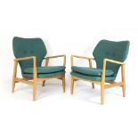 A pair of oak framed lounge armchairs with turquoise button upholstery,