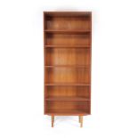 A 1970's teak open-fronted bookcase on tapering legs, h.