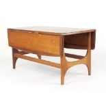 A 1960/70's 'State Room' Range teak and crossbanded drop-leaf coffee table by Stonehill, l.