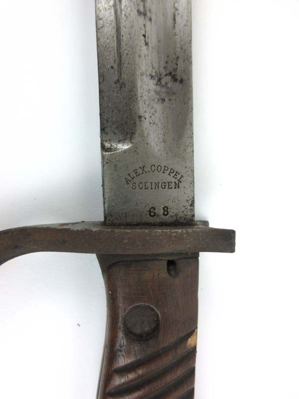 A WW1 German butcher bayonet marked 'Alex Coppel Solingen' with leather and steel scabbard and frog. - Image 2 of 2