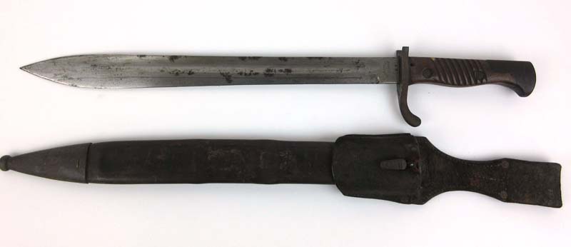 A WW1 German butcher bayonet marked 'Alex Coppel Solingen' with leather and steel scabbard and frog.