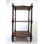 A Victorian mahogany three tier what-not,