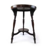 A late Victorian walnut circular occasional table on turned legs with under tier, h. 76 cm, dia.