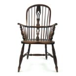 A 19th century elm and ash Windsor chair with a pierced splat, turned arm supports,