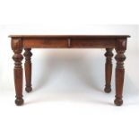 A 19th century teak two drawer writing table, the quarter veneered top with marquetry,