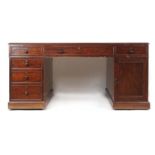 A 19th century mahogany partners desk by M.