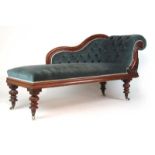 A Victorian mahogany chaise longue upholstered in a blue button back fabric on turned legs, h.