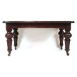 A Victorian mahogany extending dining table,