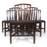 A set of six George III mahogany dining chairs upholstered in black woven horse hair on a drop in