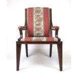 A Regency and later mahogany open arm chair upholstered in a floral striped fabric,