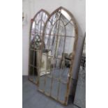 GARDEN MIRRORS, a pair, Gothic style architectural metal frames, 160cm x 67cm.