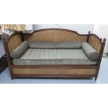 SIMON HORN DAYBED, Louis XVI style, with acorn shaped finials, a double caned back and top sides,