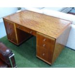 PEDESTAL DESK, mid 20th century birch and other woods with two slides and eight drawers,