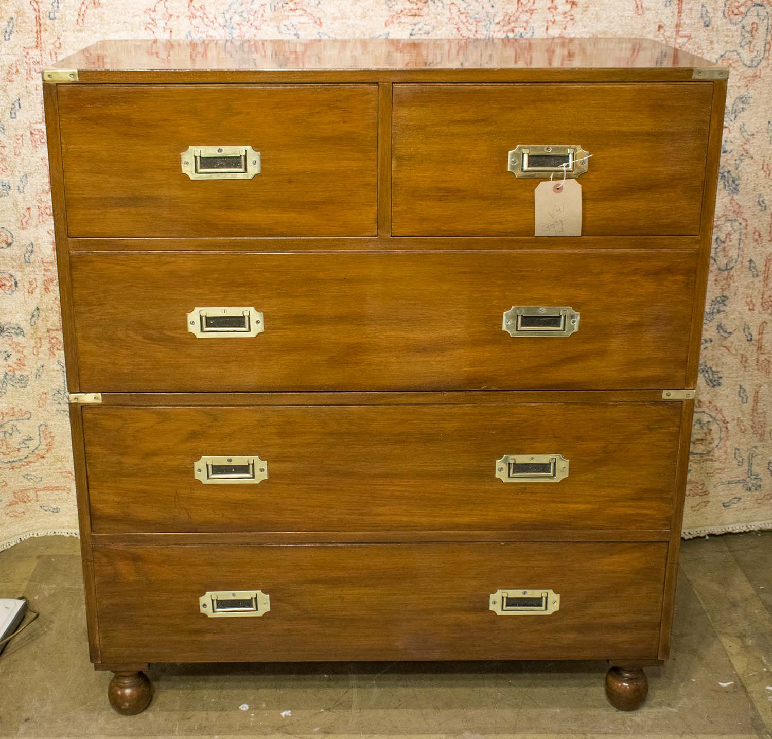 CAMPAIGN CHEST, vintage mahogany and brass bound in two sections with turned supports,