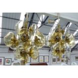 CHANDELIERS, a pair, vintage 1970's, brass with yellow globe shades, 65cm H.